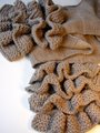 Ruffle detail on scarf.