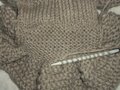 Picking up stitches for additional ruffles.