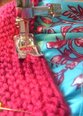 Change sewing machine to stitch length 4.  Attach bodice to skirt by sewing in the ditch between the first and second garter ridges.